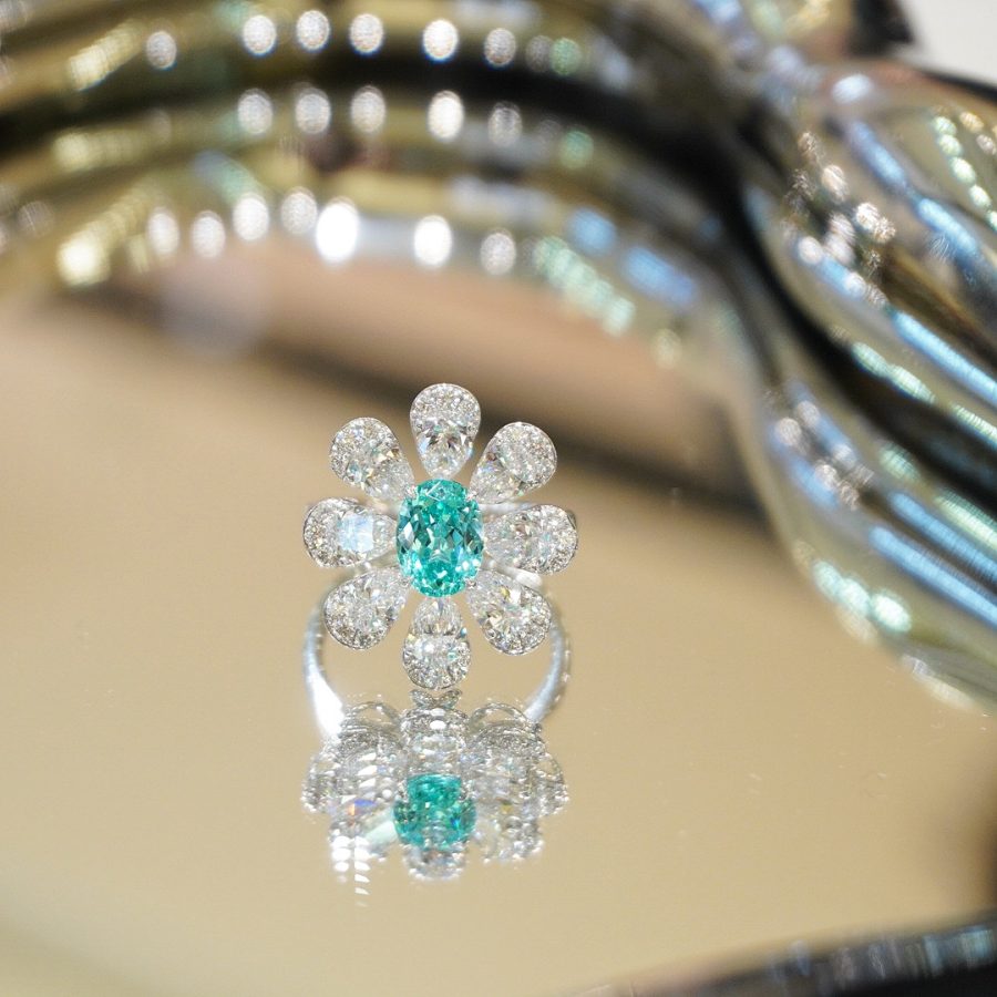 A ring set with lab-grown gemstones in 18k gold