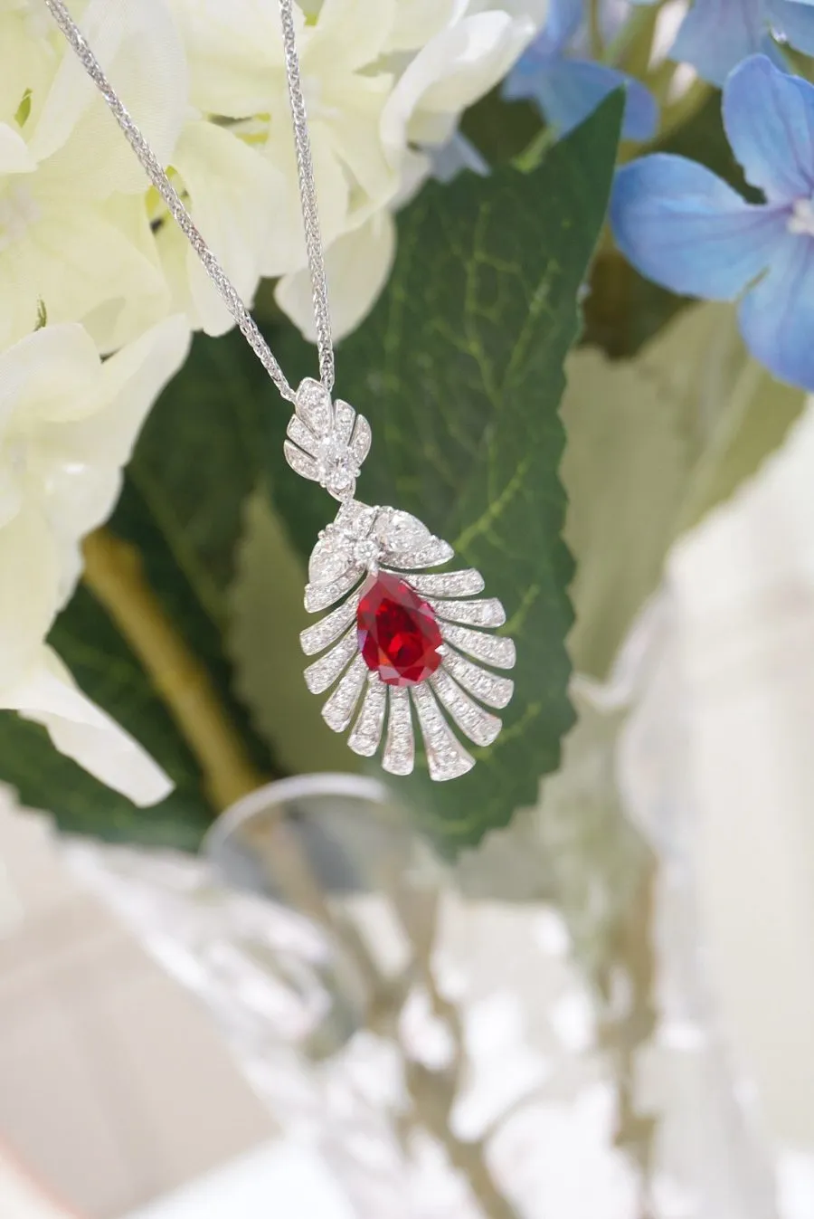 18k gold lab-grown ruby feather pendant